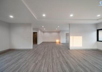 Modern spacious unfurnished living area with open floor plan, recessed lighting, and wood flooring