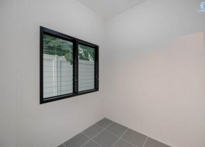 Modern bathroom with window and tiled flooring