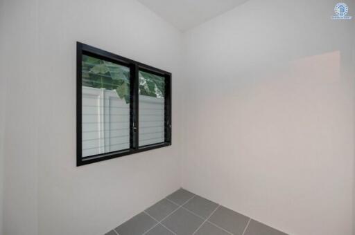 Modern bathroom with window and tiled flooring