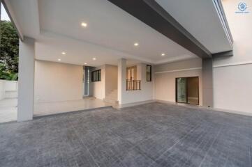 Spacious and well-lit empty carport area of a modern building