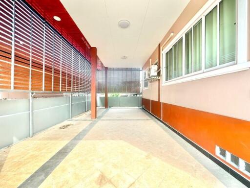 Spacious balcony with tiled floor and modern sliding windows