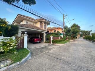 Spacious two-story house with garage and lush garden