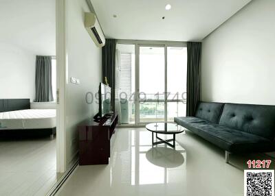 Spacious bedroom with modern furniture and plenty of natural light