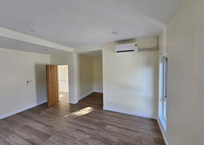 Spacious modern living room with hardwood floors
