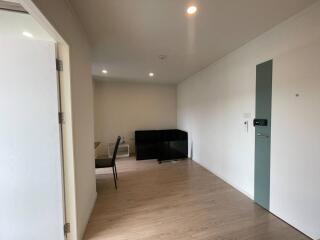 Spacious and well-lit living room with hardwood floors