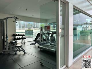 Modern gym facility with cardio equipment and weights