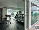 Modern gym facility with cardio equipment and weights