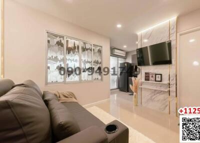 Modern living room with comfortable seating and entertainment unit