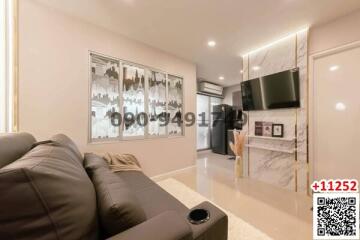 Modern living room with comfortable seating and entertainment unit