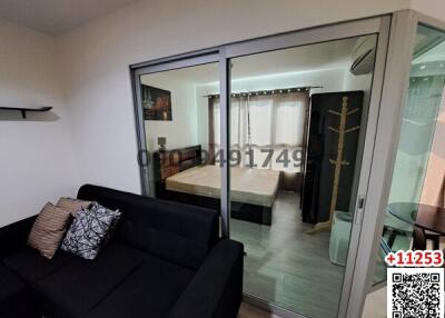 Modern studio apartment with combined living and sleeping space with sliding glass partition