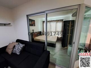 Modern studio apartment with combined living and sleeping space with sliding glass partition