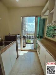 Bright kitchen with modern amenities and balcony access