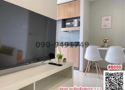 Modern living room with integrated kitchenette