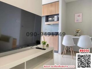 Modern living room with integrated kitchenette