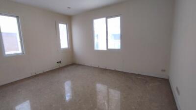 Spacious empty bedroom with natural lighting