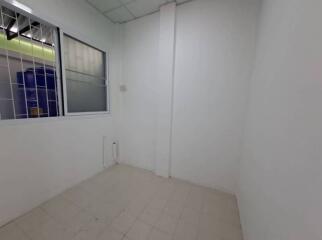 Empty room with tiled flooring and natural light coming from the windows