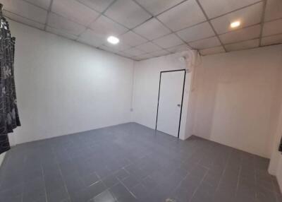 Unfurnished Bedroom with Tiled Flooring and Recessed Lighting
