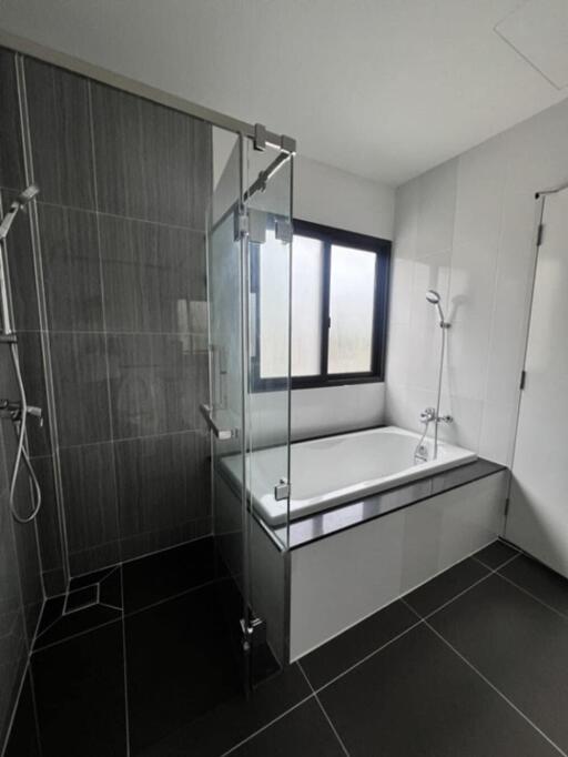 Modern bathroom with glass shower and bathtub