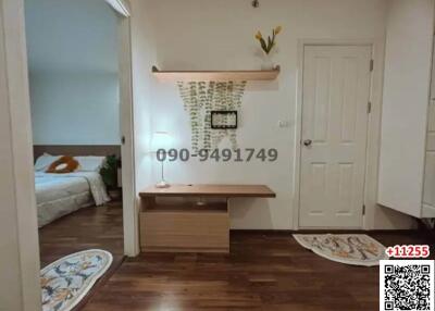 Modern entryway with stone accent wall and wooden console table