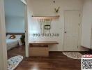 Modern entryway with stone accent wall and wooden console table