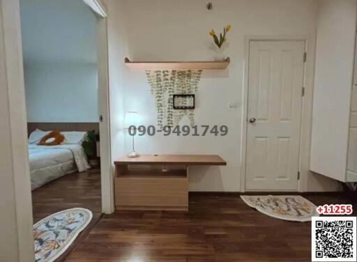 Modern entryway with stone accent wall and wooden console table