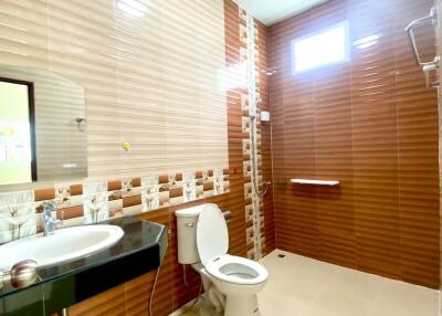 Modern bathroom interior with tiled walls