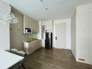 Modern kitchen with integrated appliances and wooden flooring