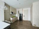 Modern kitchen with integrated appliances and wooden flooring