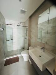 Modern bathroom with shower, toilet, and sink