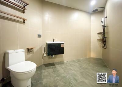 Modern bathroom with wall tiles and walk-in shower