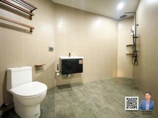 Modern bathroom with wall tiles and walk-in shower