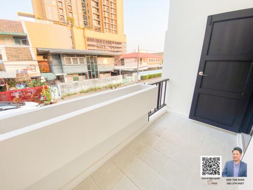 Spacious balcony with urban view and safety railing