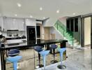Modern kitchen with marble floors and central island