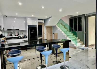 Modern kitchen with marble floors and central island