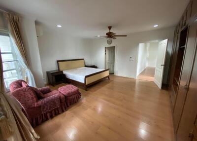 Spacious Bedroom with Hardwood Floors and Natural Light