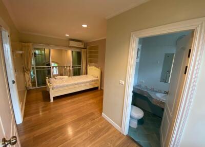 Spacious bedroom with ensuite bathroom and balcony access