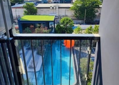 Balcony with pool view in a residential area