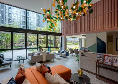 Spacious modern lobby interior with comfortable seating and colorful lighting