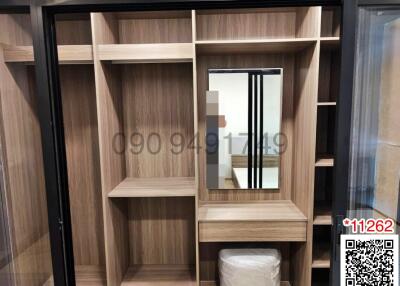 Modern wooden wardrobe with sliding doors and built-in dressing table