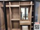 Modern wooden wardrobe with sliding doors and built-in dressing table