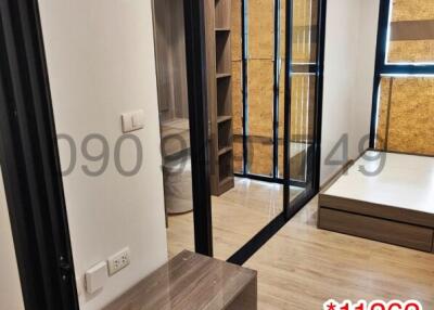 Modern bedroom with large glass door wardrobe and air conditioner