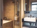 Modern bathroom interior with glass shower and double sink