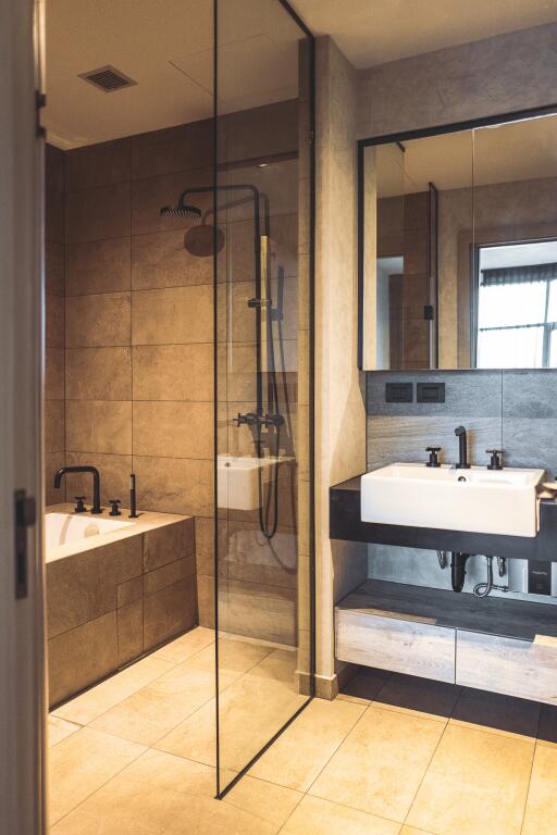 Modern bathroom interior with glass shower and double sink