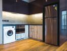 Modern kitchen with stainless steel appliances and wooden accents