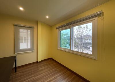 Bright and spacious empty bedroom with large window