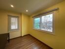 Bright and spacious empty bedroom with large window