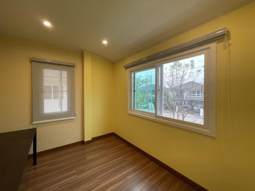 Bright and spacious empty bedroom with large window