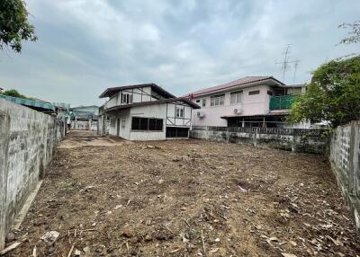 Vacant land in front of residential buildings