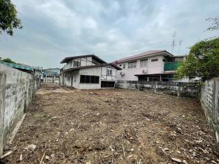 Vacant land in front of residential buildings