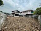 Vacant land in front of residential buildings